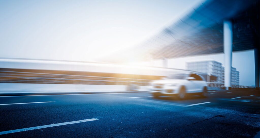 A car speeding down the highway