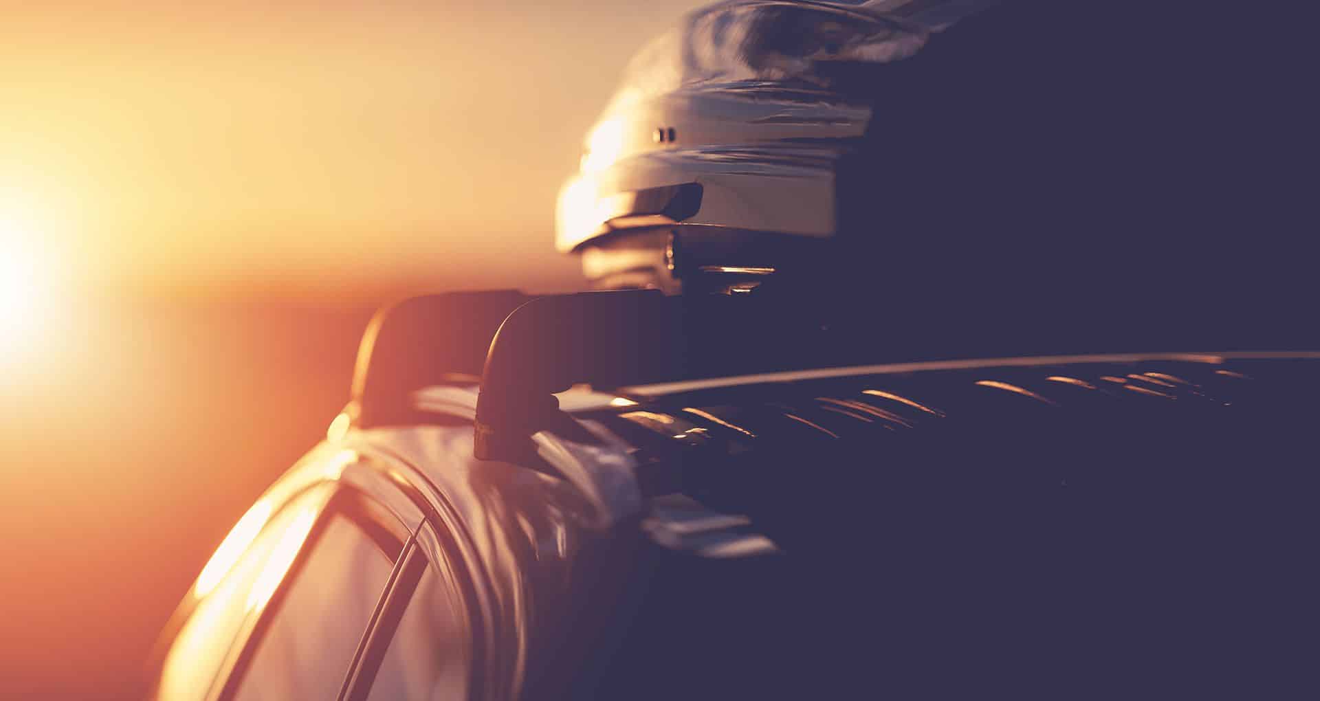 Close up photo of a car with a roof-mounted kayak